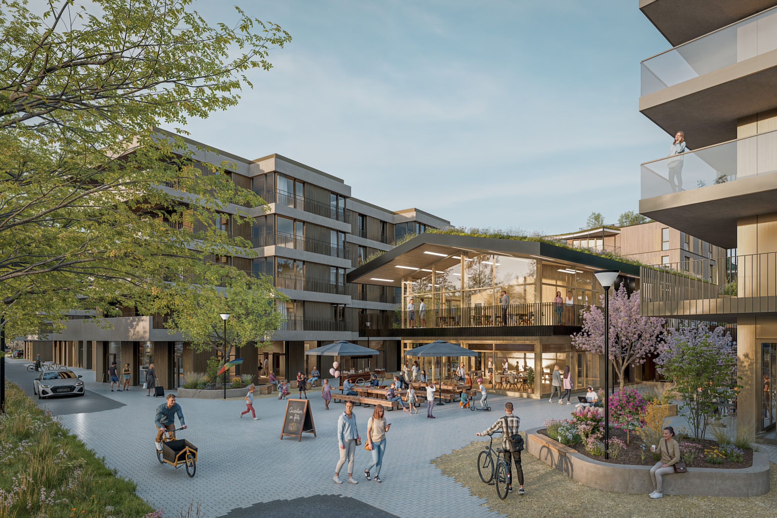 Rendu du quartier En Carouge : place animée avec terrasse de café, commerces et vélo-cargo